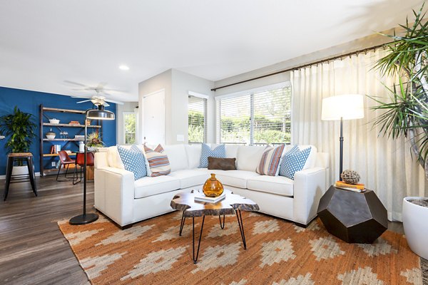 Cozy living room with elegant furnishings at St Moritz Apartments, luxury rental by Greystar