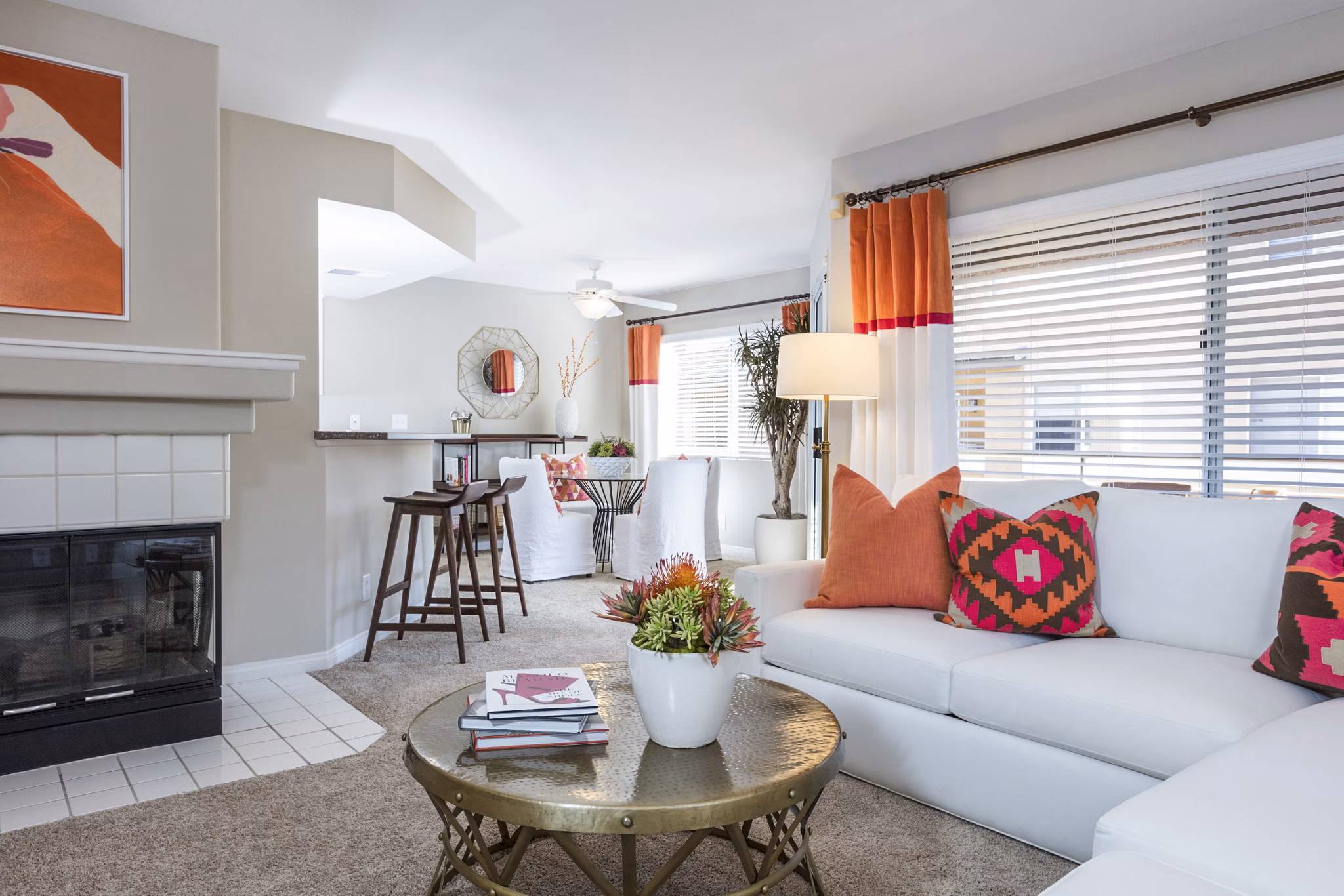 Living area with contemporary furniture and large windows at St Moritz Apartments