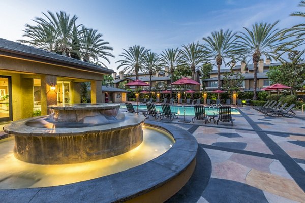 Relaxing pool patio with chic loungers at St Moritz Apartments, perfect for luxury living and leisure