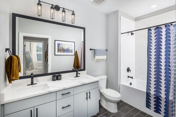 Modern bathroom with sleek fixtures at Broadstone Optimist Park Apartments, luxury living space in a premier location