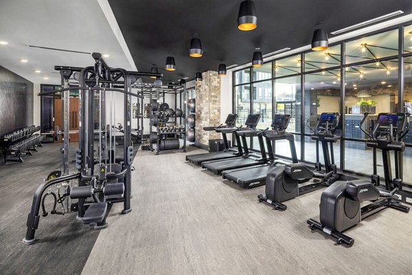 Fully-equipped fitness center at Broadstone Optimist Park Apartments offers state-of-the-art facilities for residents to stay active and healthy
