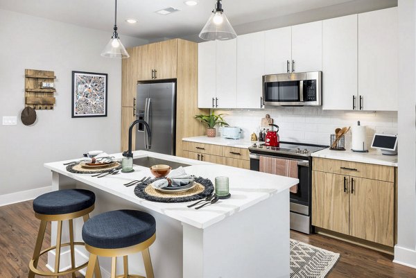 Modern kitchen with stainless steel appliances at Broadstone Optimist Park Apartments