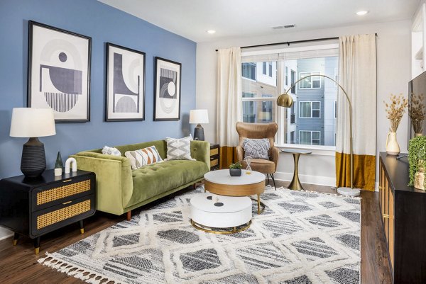 Spacious living room with contemporary furniture at Broadstone Optimist Park Apartments