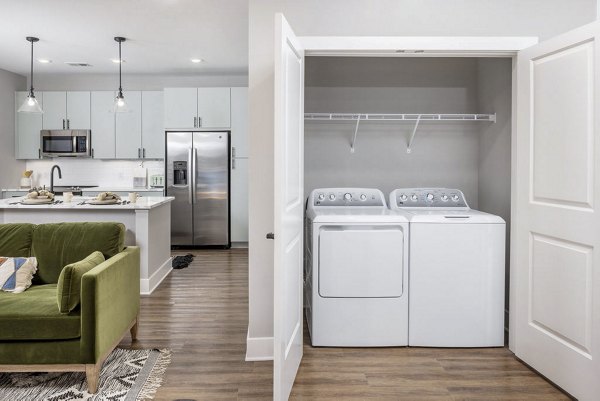 Laundry room with state-of-the-art appliances at Broadstone Optimist Park Apartments