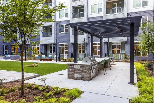 Grill area with modern patio at Broadstone Optimist Park Apartments