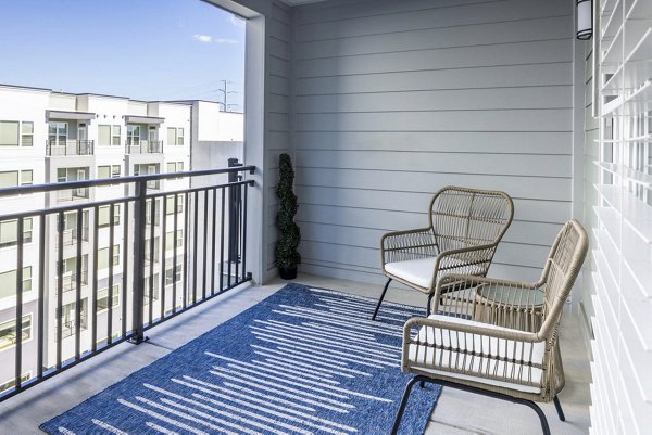 Spacious patio with scenic views at Broadstone Optimist Park Apartments, perfect for relaxation and outdoor dining