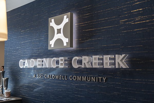 clubhouse signage at Cadence Creek at Towne Lake Apartments