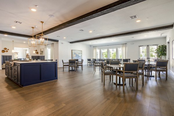 Stylish clubhouse with cozy seating at Cadence Creek at Towne Lake Apartments