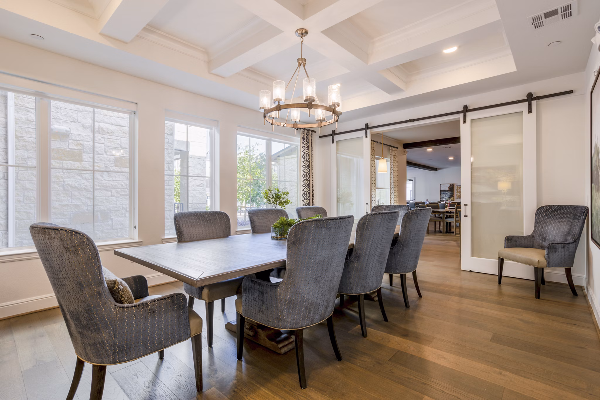 Modern clubhouse meeting facility with elegant seating at Cadence Creek at Towne Lake Apartments, offering luxurious community space for residents