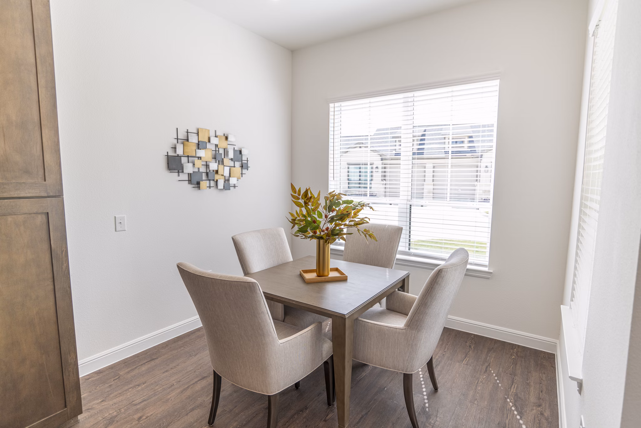 Dining room with modern decor and ample natural light in Cadence Creek at Towne Lake Apartments