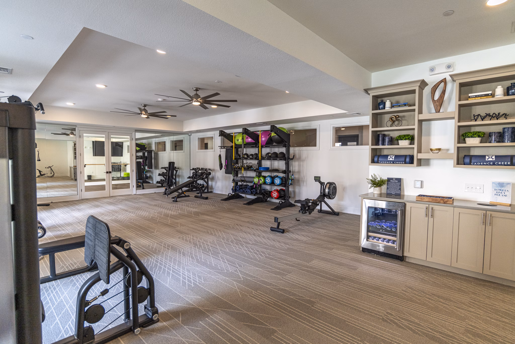 Modern fitness center with state-of-the-art equipment at Cadence Creek at Towne Lake Apartments