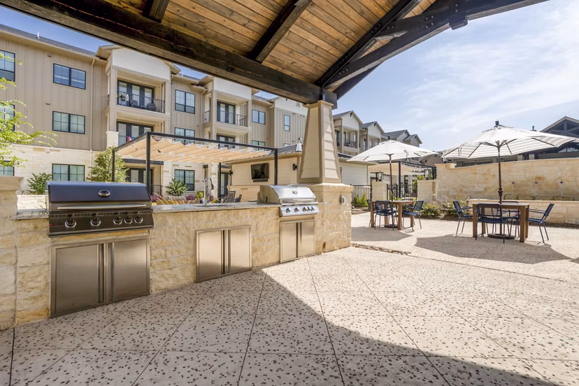 Grill and lounge area on patio at Cadence Creek at Towne Lake luxury apartments