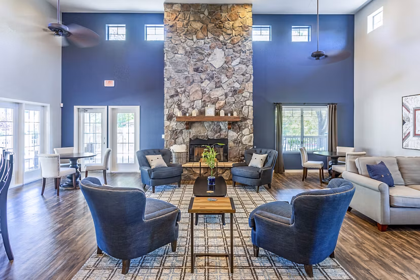 Clubhouse with modern design and cozy seating at Legacy at Prescott Lakes Apartments