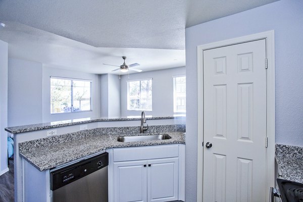Modern kitchen with stainless steel appliances at Legacy at Prescott Lakes Apartments