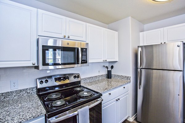 Modern kitchen featuring stainless steel appliances at Legacy at Prescott Lakes Apartments