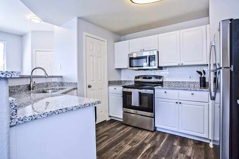 Modern kitchen featuring stainless steel appliances in Legacy at Prescott Lakes Apartments