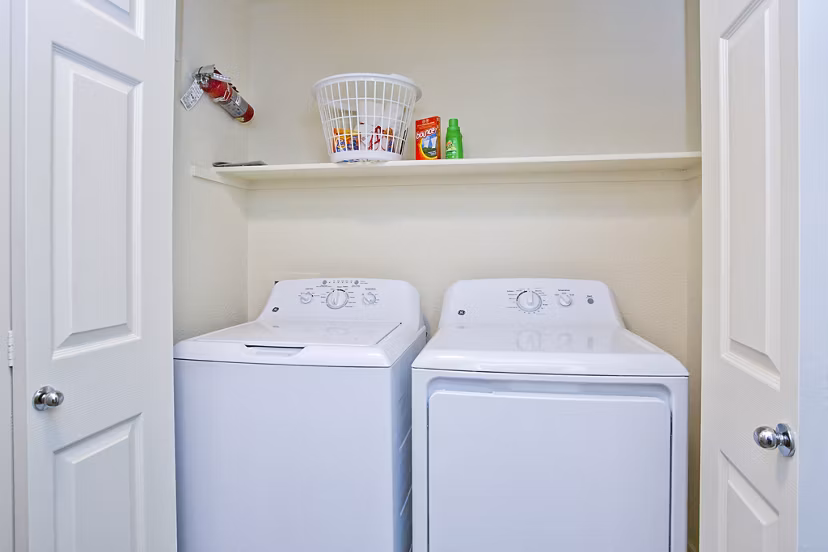 Modern laundry room with energy-efficient washers and dryers at Legacy at Prescott Lakes Apartments