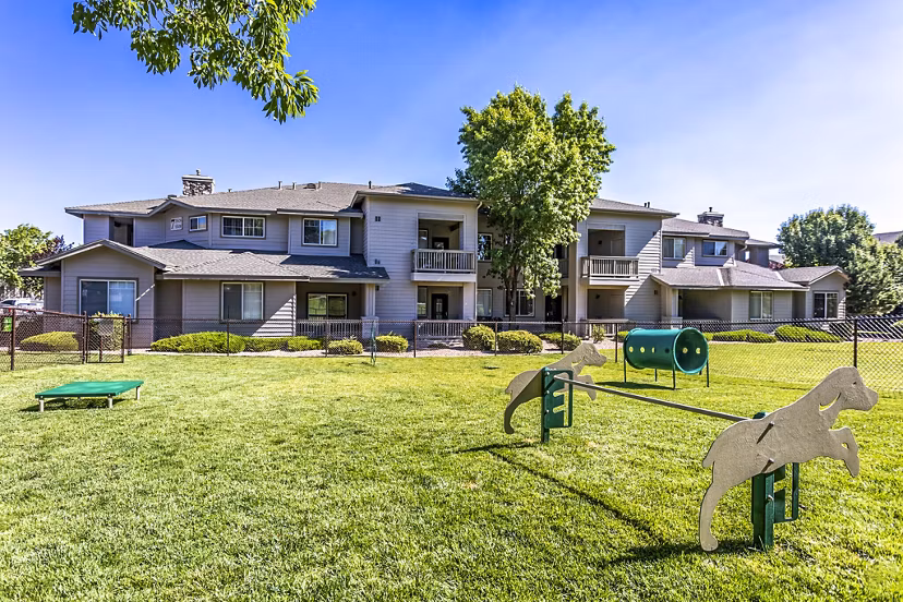 Pet-friendly dog park with agility equipment at Legacy at Prescott Lakes Apartments