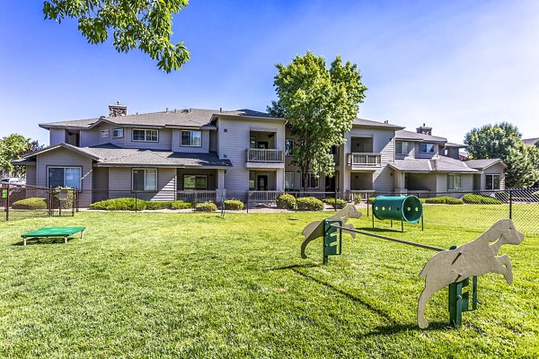 Pet-friendly dog park with agility equipment at Legacy at Prescott Lakes Apartments