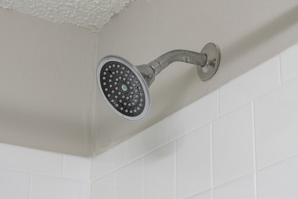 Four Lakes at Clearwater: Modern bathroom with sleek fixtures and ample lighting in luxury apartments
