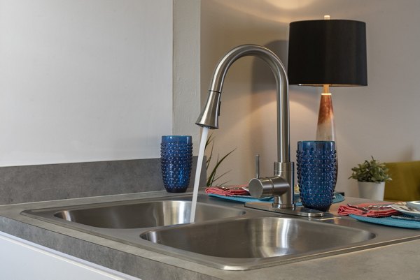 Modern kitchen featuring sleek appliances at Four Lakes at Clearwater Apartments