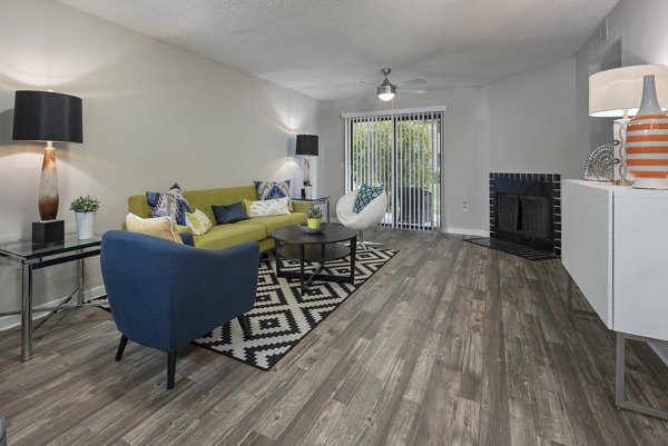 Spacious living room with modern furnishings at Four Lakes at Clearwater Apartments