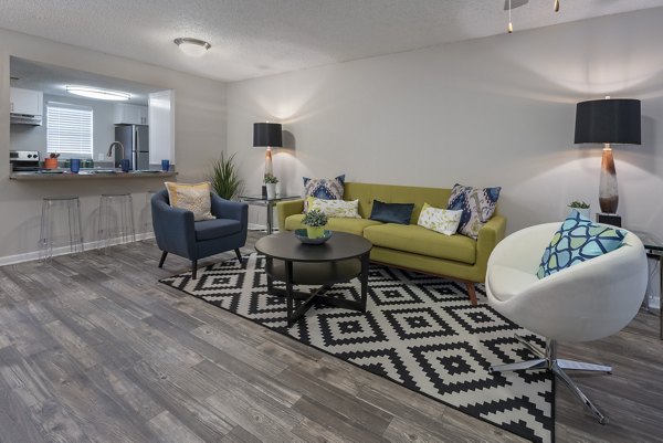 Spacious living room with modern decor at Four Lakes at Clearwater Apartments