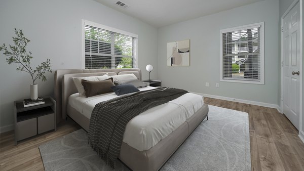 Cozy bedroom with modern decor at Landings at Sweetwater Creek Apartments