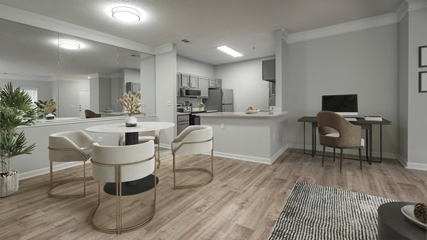 Dining area featuring sleek modern furniture at Landings at Sweetwater Creek Apartments, offering a luxurious living experience
