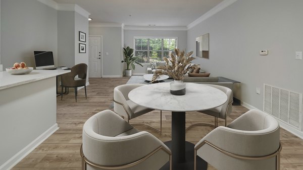 Dining area featuring elegant decor and modern furniture at Landings at Sweetwater Creek Apartments