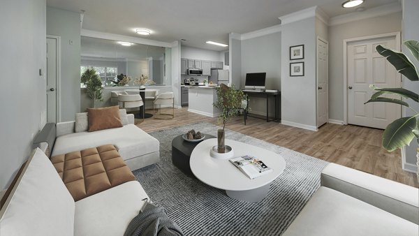Spacious living room with modern dÃ©cor in Landings at Sweetwater Creek Apartments
