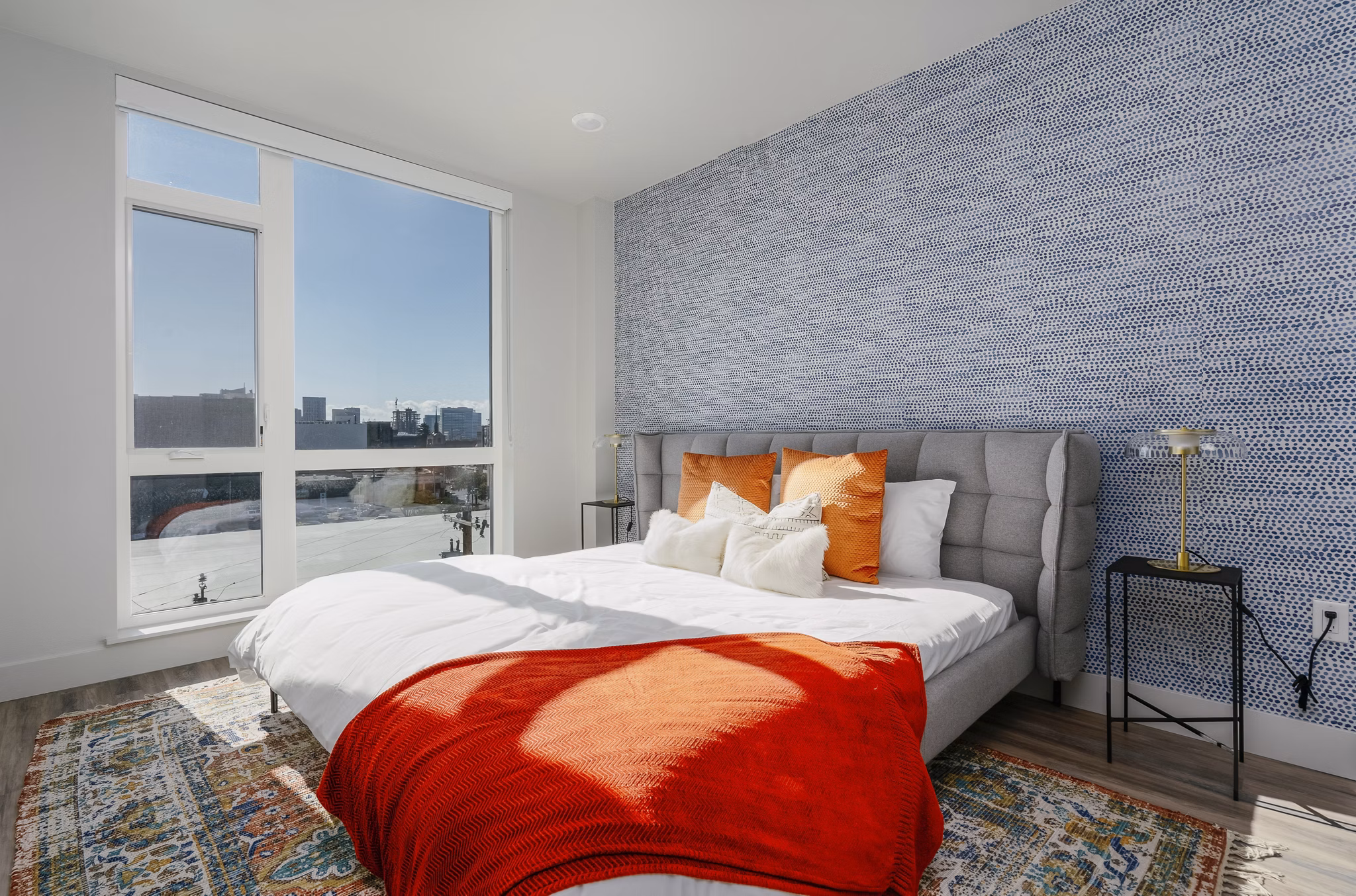Cozy bedroom with modern decor at Assembly Apartments