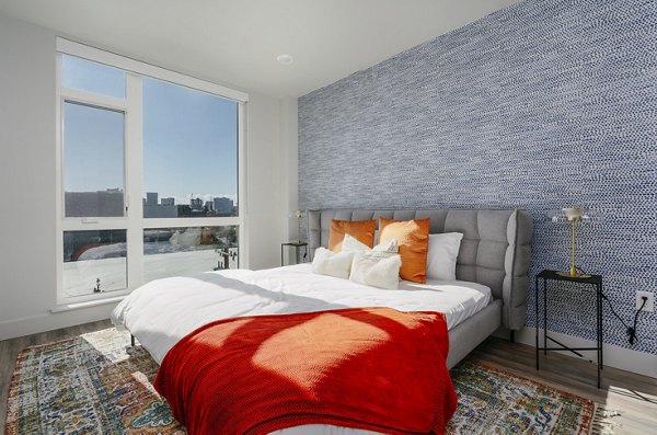 Cozy bedroom with modern decor at Assembly Apartments