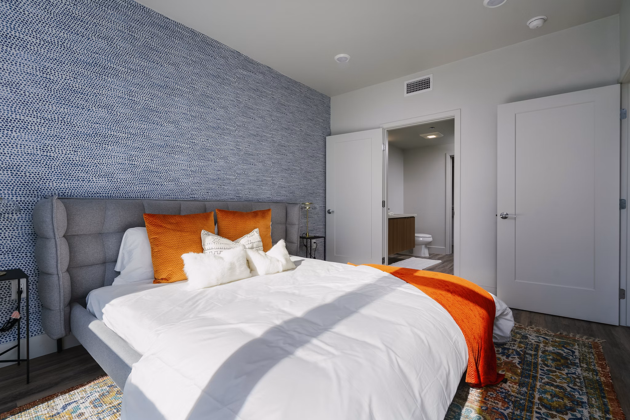 Cozy bedroom with modern decor at Assembly Apartments