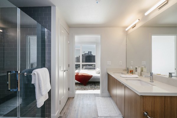 Modern bathroom with sleek fixtures at Assembly Apartments, offering luxury living in a premier community