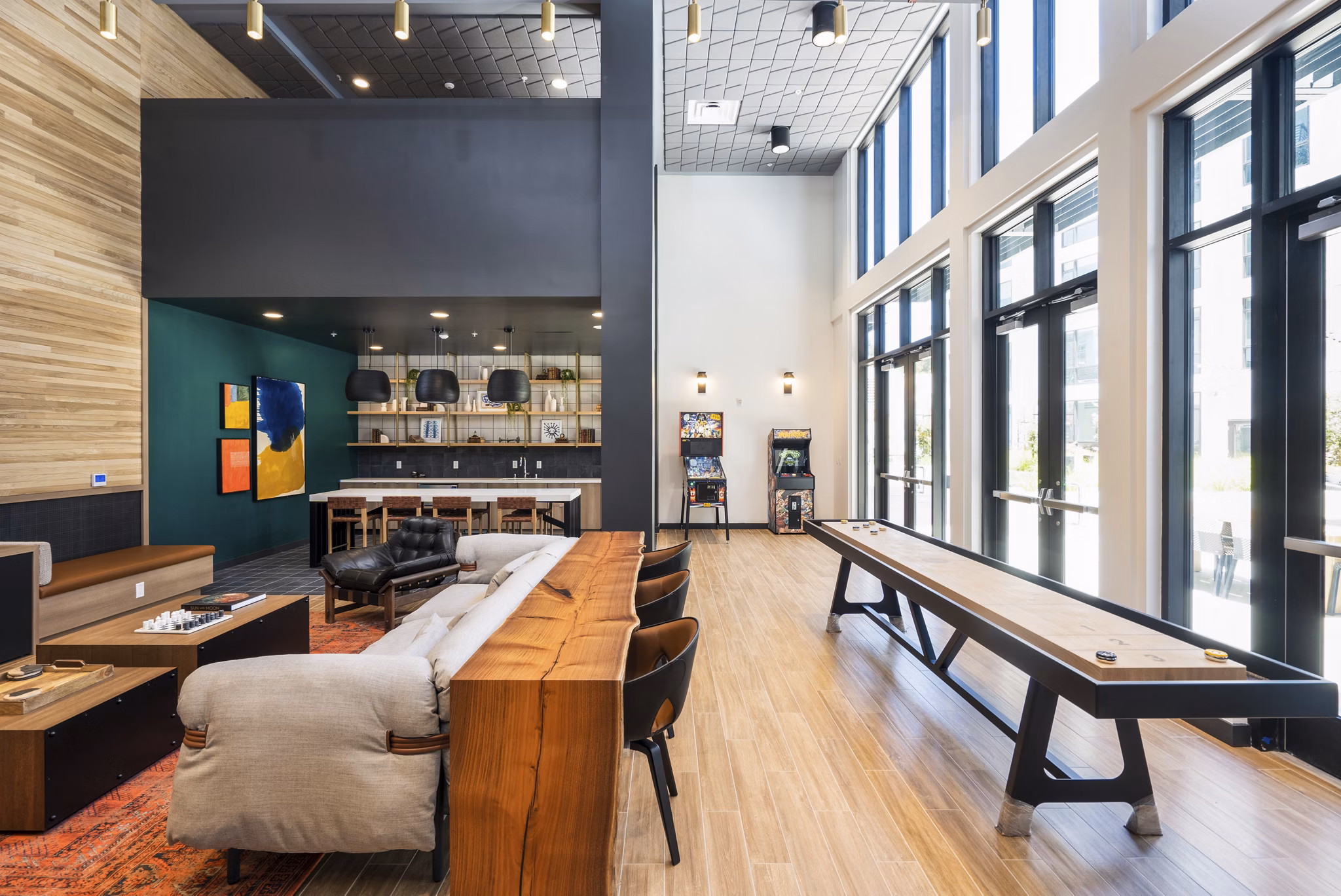 Clubhouse with modern decor and seating at Assembly Apartments Ideal for social gatherings and relaxation in a welcoming community space