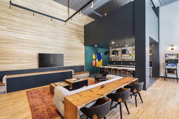 Modern clubhouse with stylish furnishings at Assembly Apartments, a Greystar luxury community in vibrant city setting
