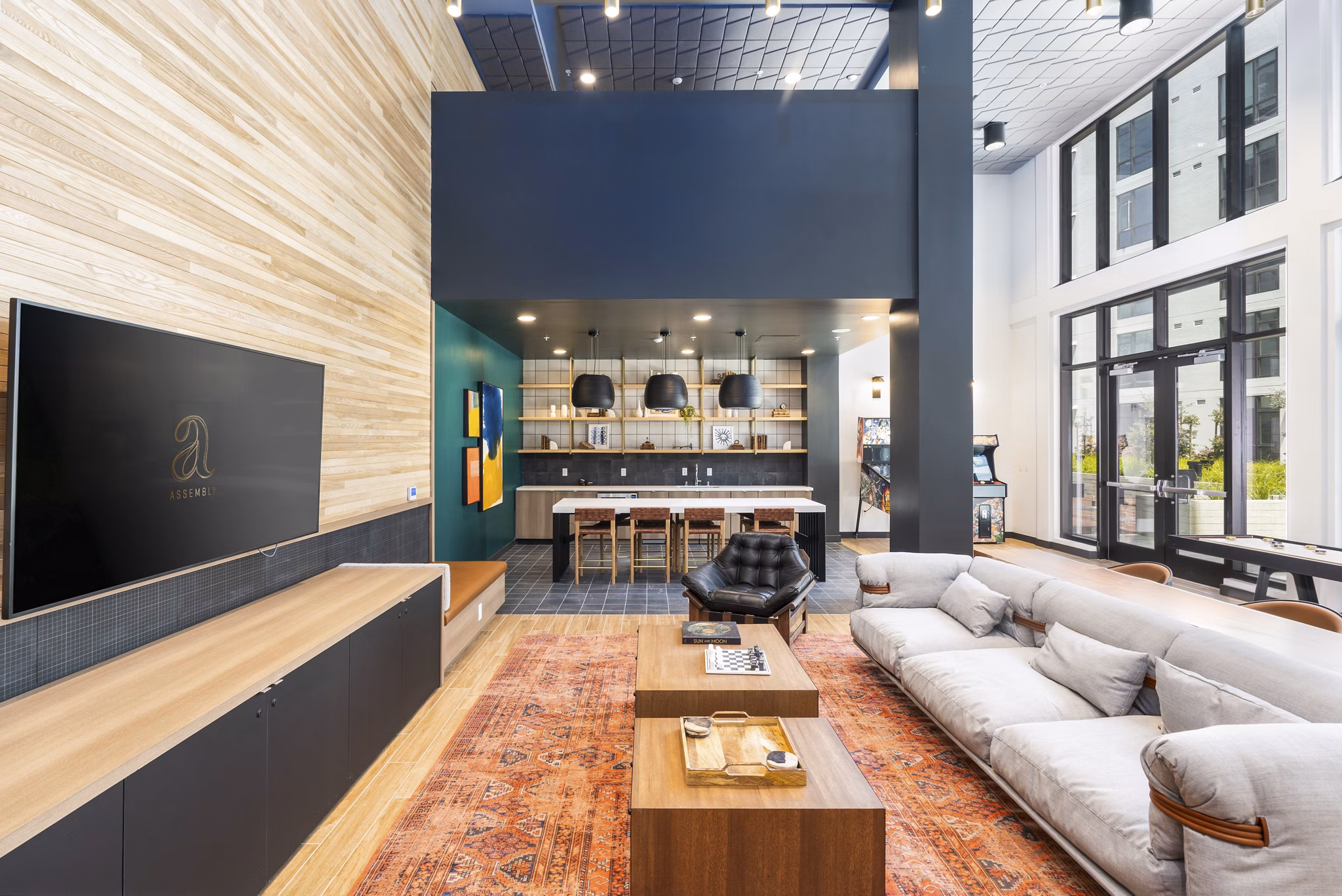 Clubhouse featuring modern design and ample seating at Assembly Apartments