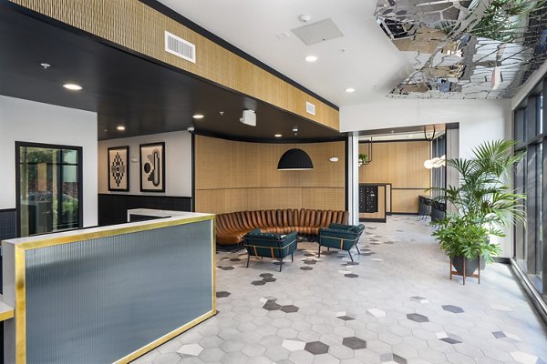 Clubhouse featuring modern design and lounge area at Assembly Apartments