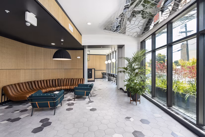 Modern clubhouse with stylish seating at Assembly Apartments, a Greystar luxury community