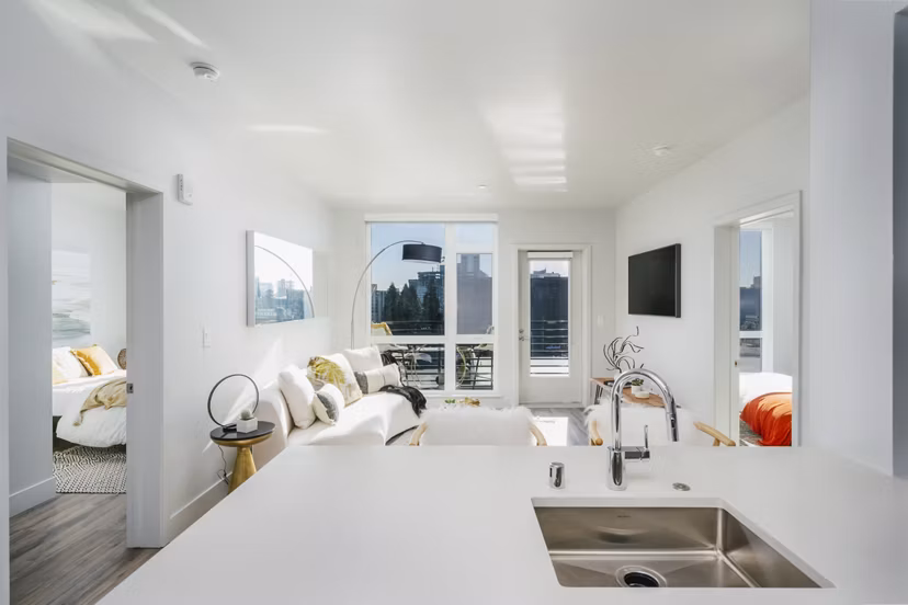 Assembly Apartments: Modern kitchen with stainless steel appliances in a luxury setting