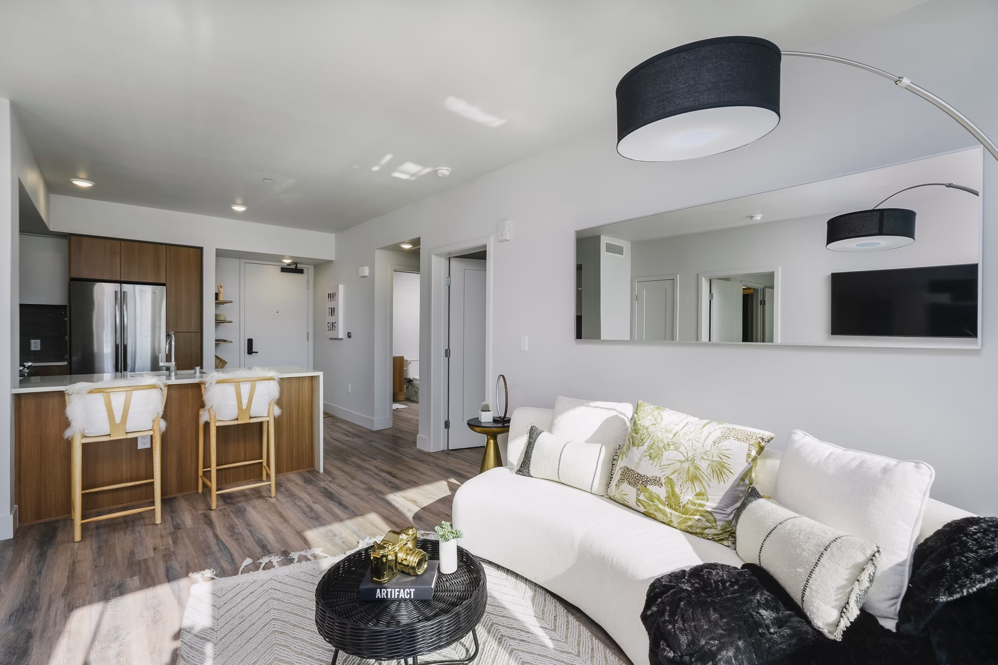 Cozy living room with modern decor and natural light at Assembly Apartments
