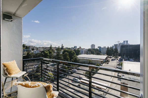 Patio with modern outdoor seating at Assembly Apartments, offering a stylish space for relaxation and socializing in urban surroundings