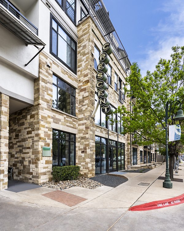 Crescent Apartments: Contemporary building design with sleek glass facade in urban setting