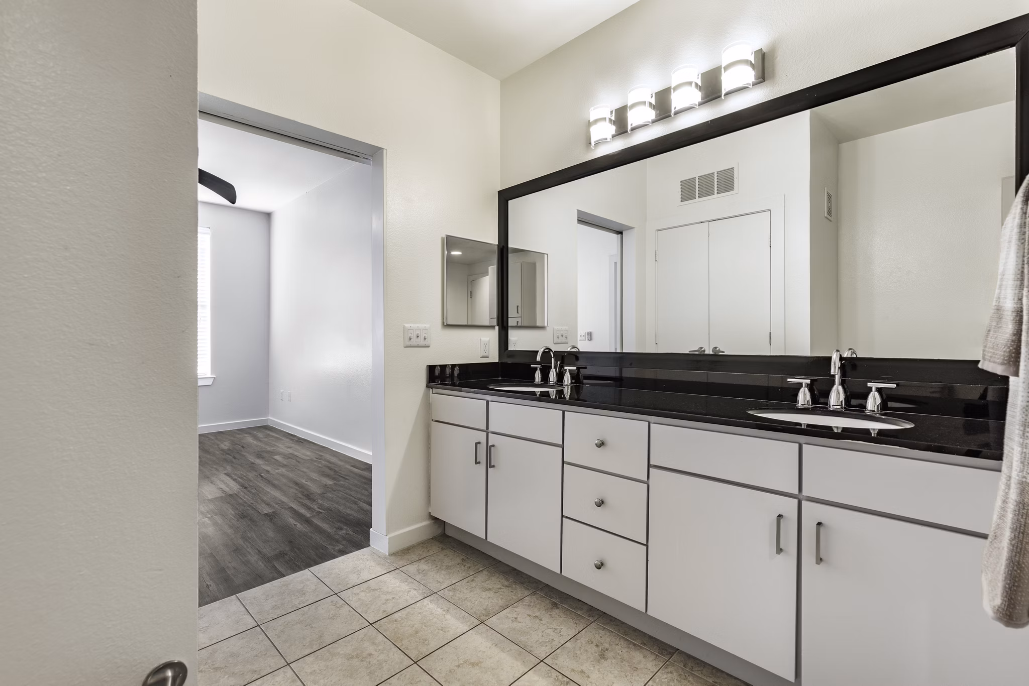 Modern bathroom with sleek fixtures at Crescent Apartments, featuring Greystar luxury design in an upscale setting