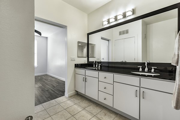 Modern bathroom with sleek fixtures at Crescent Apartments, featuring Greystar luxury design in an upscale setting