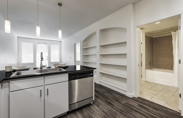 Modern kitchen featuring stainless steel appliances in Crescent Apartments, luxury living spaces by Greystar