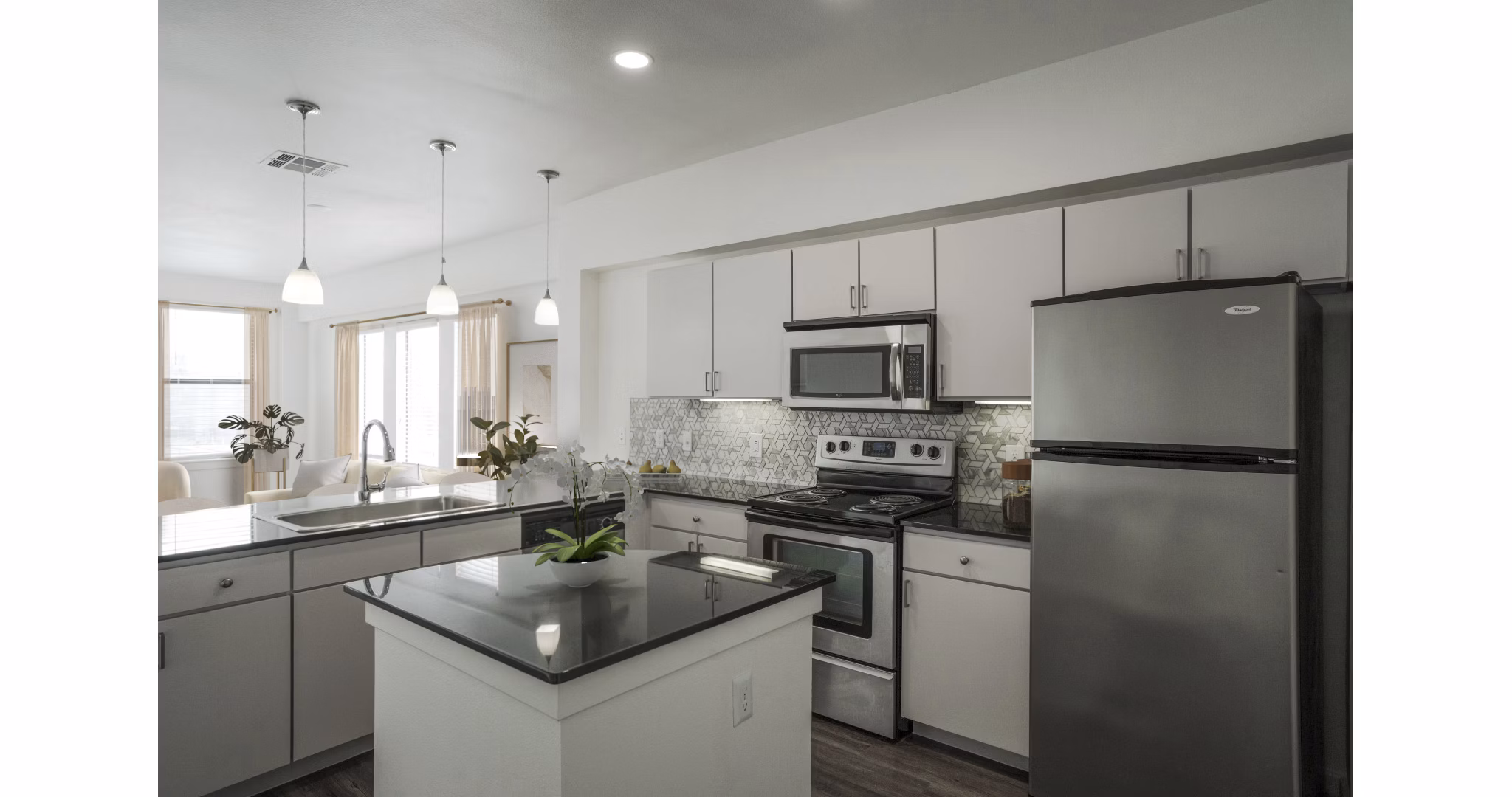 Modern kitchen with stainless steel appliances at Crescent Apartments