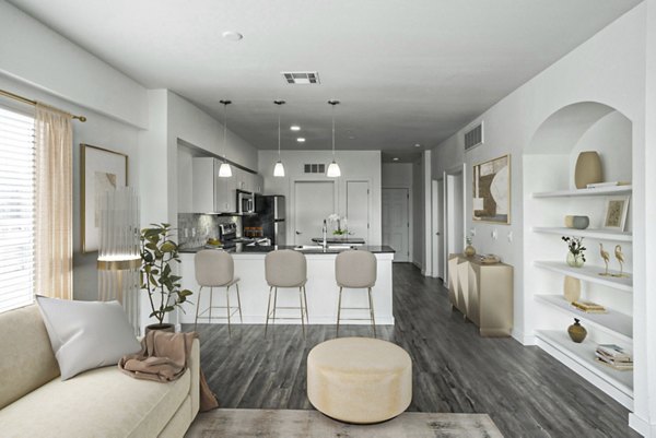 Elegant living room with modern decor and large windows at Crescent Apartments, offering luxury living in a Greystar community
