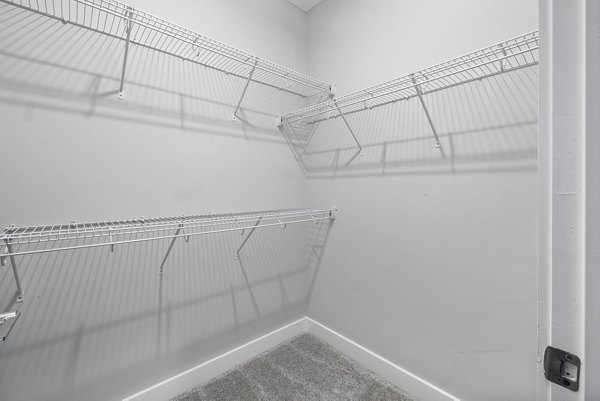 Elegant bedroom featuring modern furnishings and ample natural light at Element Barclay Station apartments